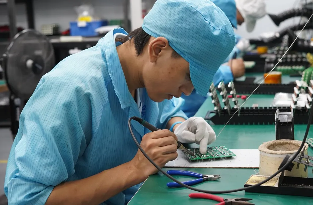 EBest PCBA engineer reviewing and working on a first-build circuit assembly