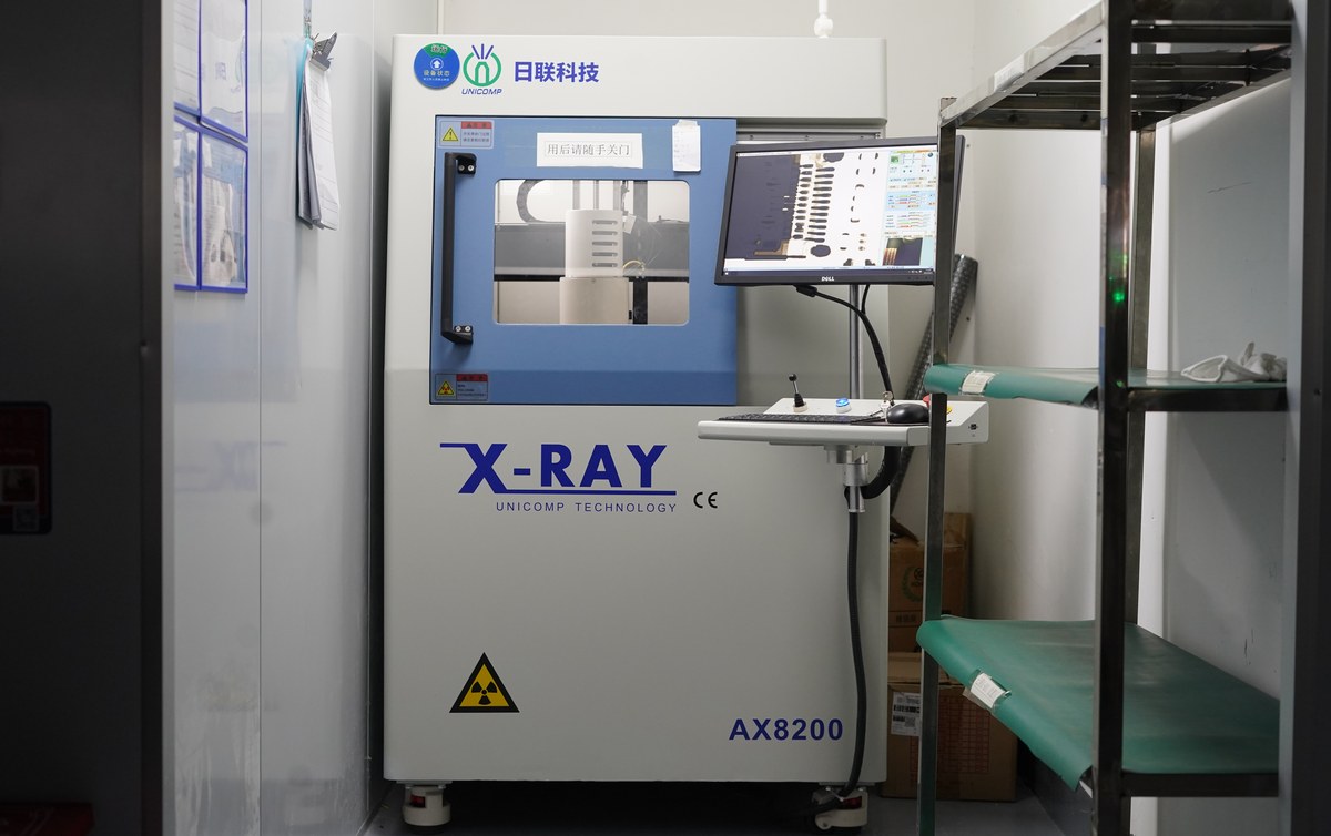 Engineer reviewing hidden solder joints with X-ray inspection equipment